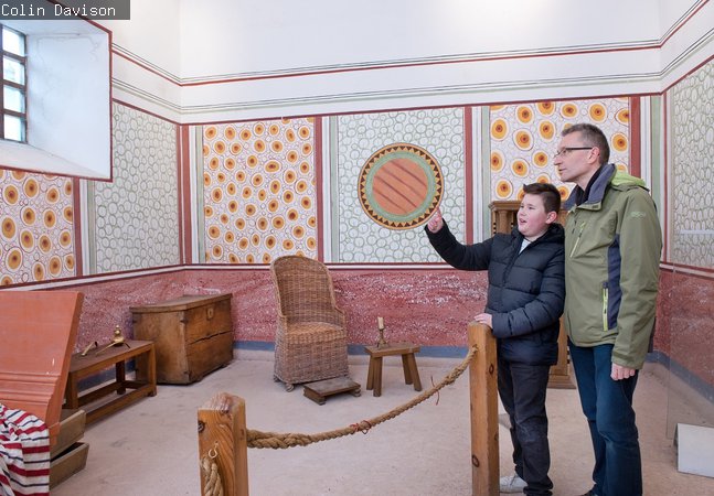 Man and boy inside the Commanding Officer's house 