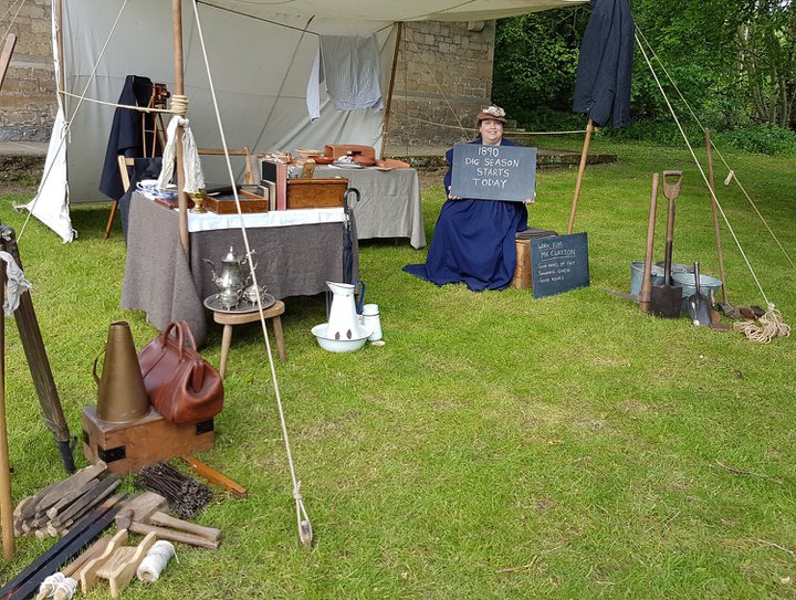 Tent open on three sides containing equipment needed to carry out archaeological digs in the 19th century
