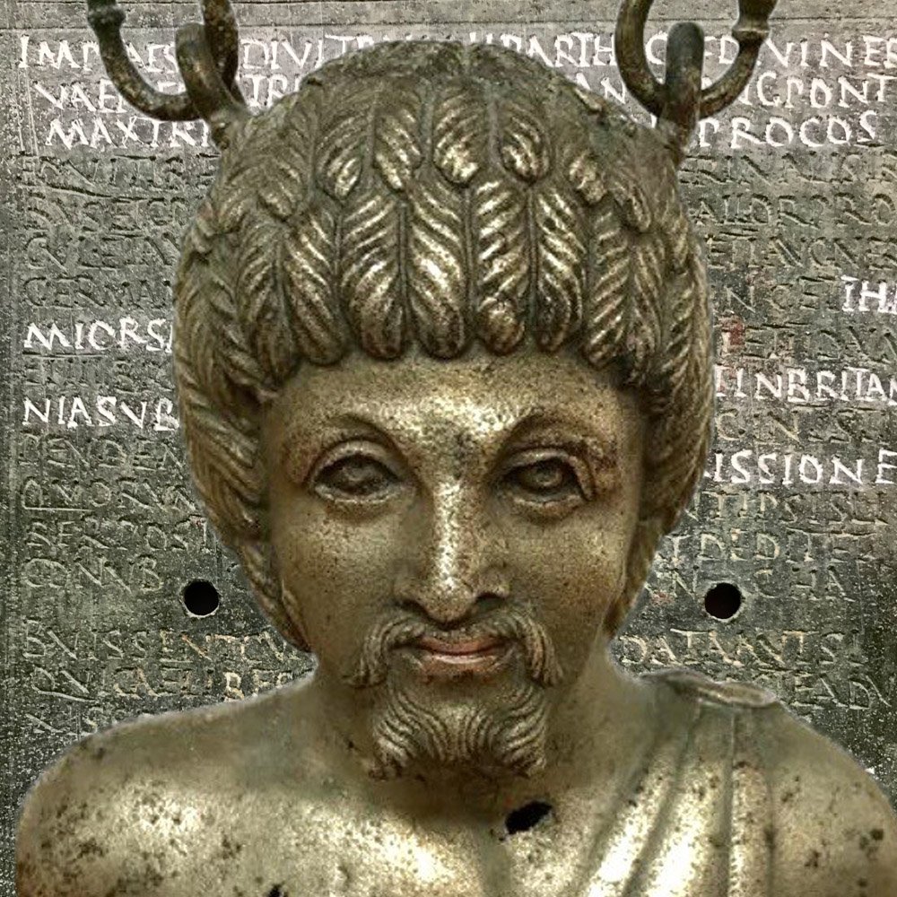 Metal artefacts showing a bust of a man.