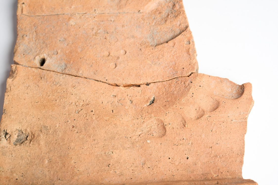 Human footprint on a Roman clay roof tile