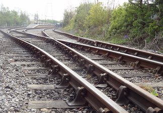 Railway tracks stretching towards the platform