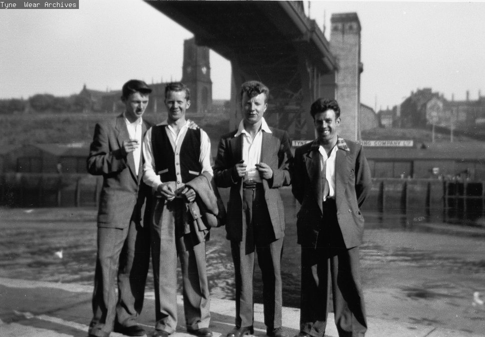 Four men at stand on the River  Tyne quayside