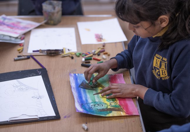 child making pastel drawing