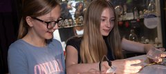 Two girls look at connections in the gallery 