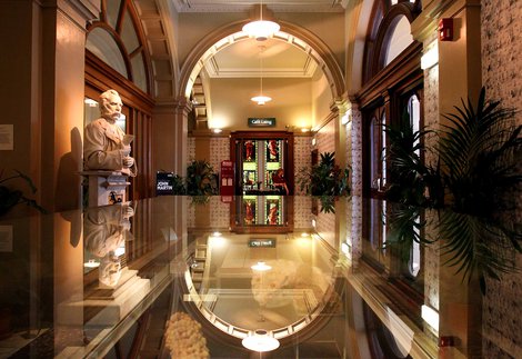 Photograph of the Laing's marble hall with a statue of founder Alexander Laing and the cafe in the background
