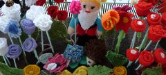 A knitted gnome and flowers