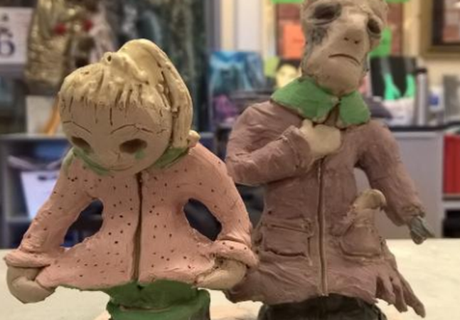 Two clay models of people