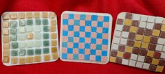 Three square coasters with mosaic tile designs
