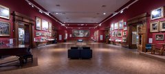 interior shot - shipley art gallery - permanent gallery - painted dark red with piano and paintings on the walls