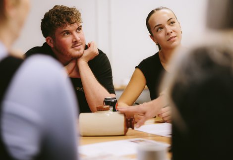 Two people at a museum workshop