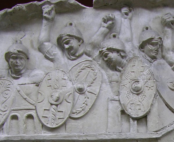 Stone sculpture of Roman soldiers with shields