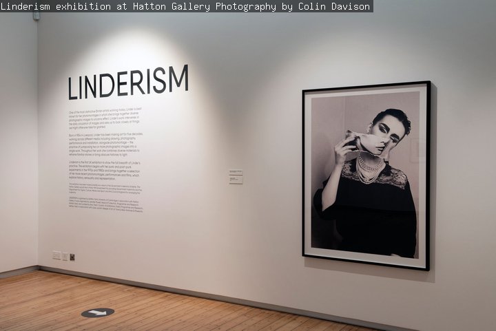 Photo of Linderism exhibition featuring a black and white photomontage and the exhibition intriduction