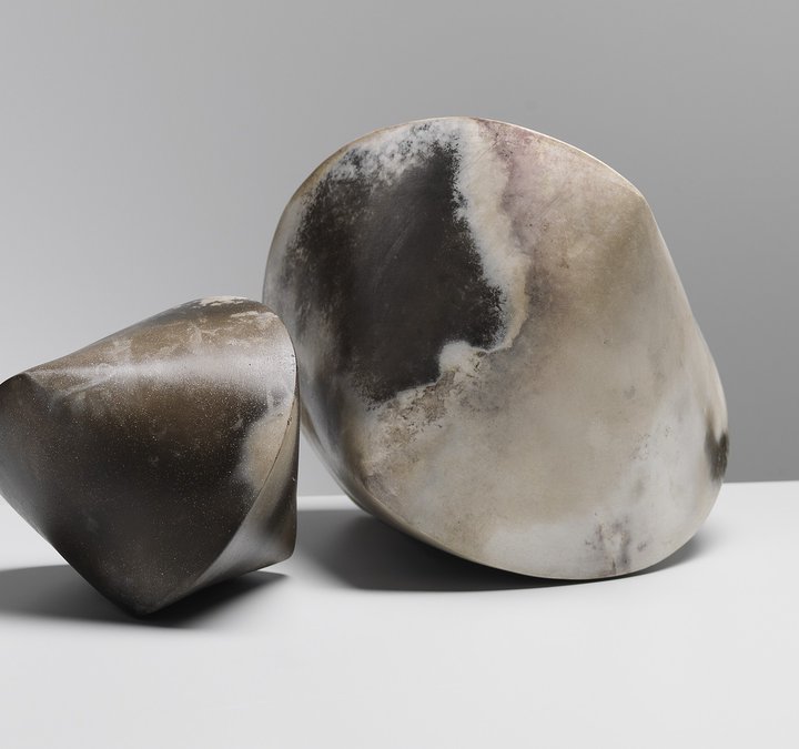 Two earthy-coloured cyclinder/triangular ceramic pieces by artist Mella Shaw