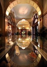 Photograph of the Laing's marble hall with a statue of founder Alexander Laing and the cafe in the background