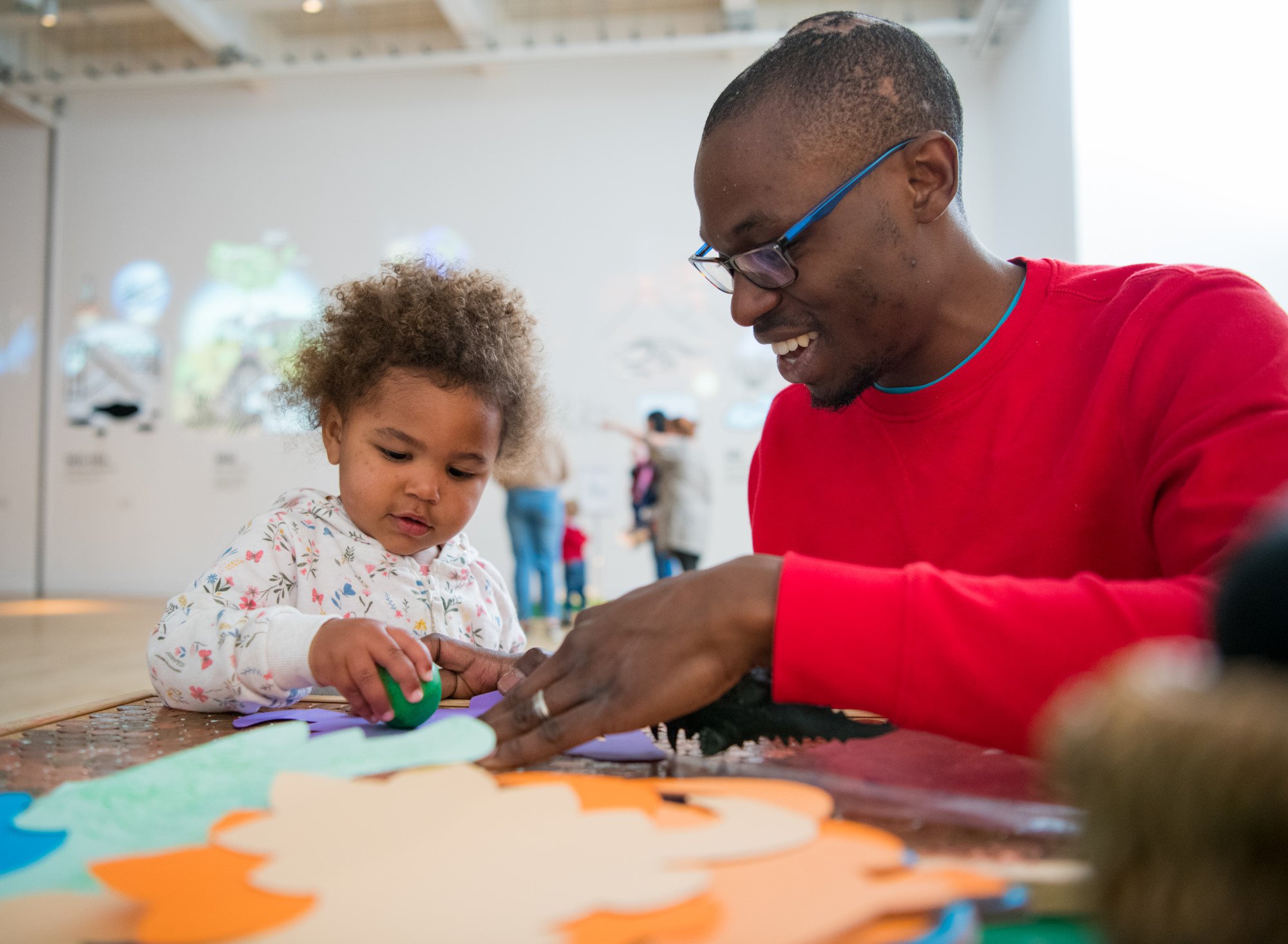 A father and daughter enjoy a craft activity in the Great North Museum