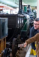 Visitors beside Locomotion No 1 - Object on loan from the National Railway Museum’
