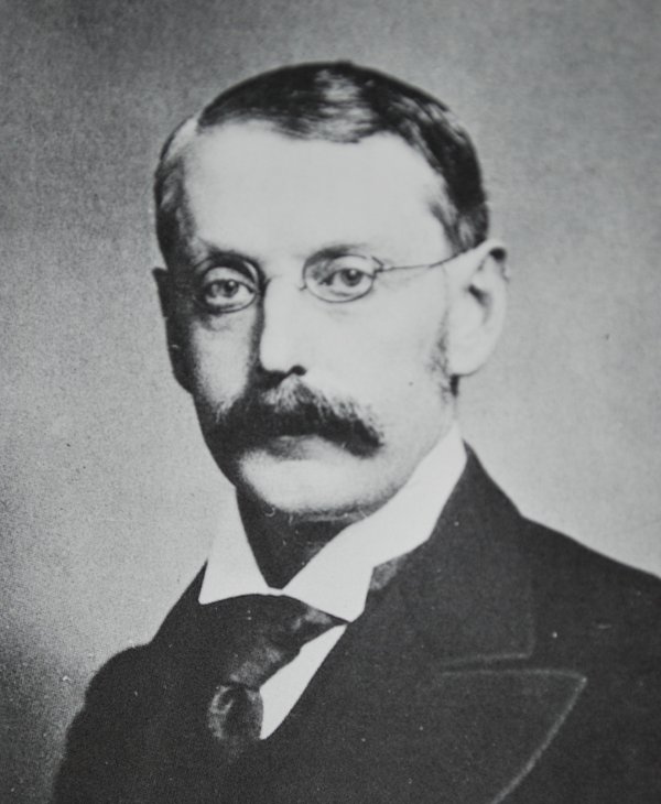A portrait of Parsons wearing glasses A portrait of Parsons wearing glasses