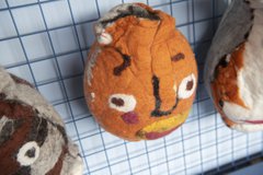 Head made from felt in the shape of a pot