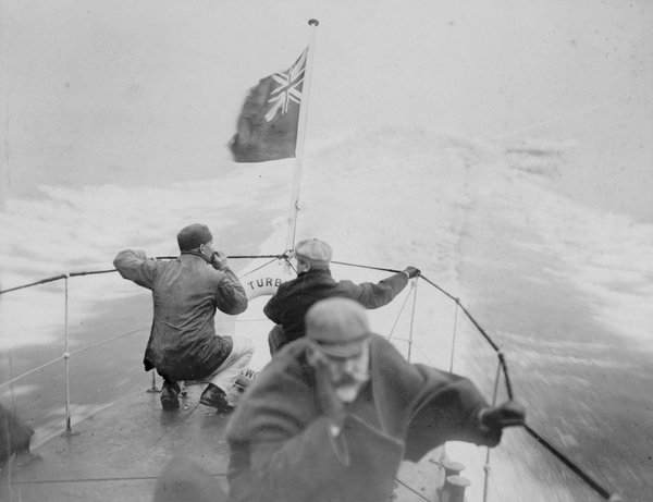 Turbinia at sea from the foredeck with 3 crew members