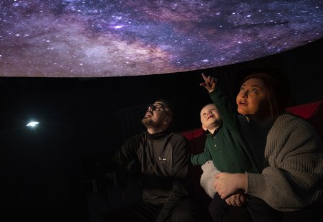 A family in a planetarium 