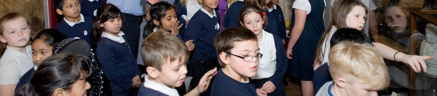 Adam Bell showing school children the gallery