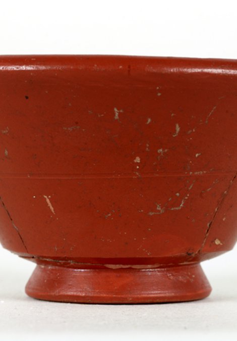 This is a samian drinking cup, imported from Franc