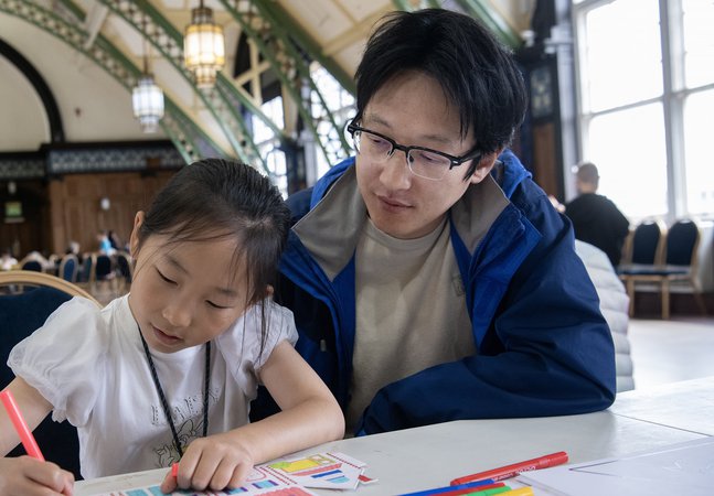 dad and daughter work together 