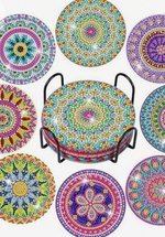 A set of decorated coasters in multi coloured gemstones.