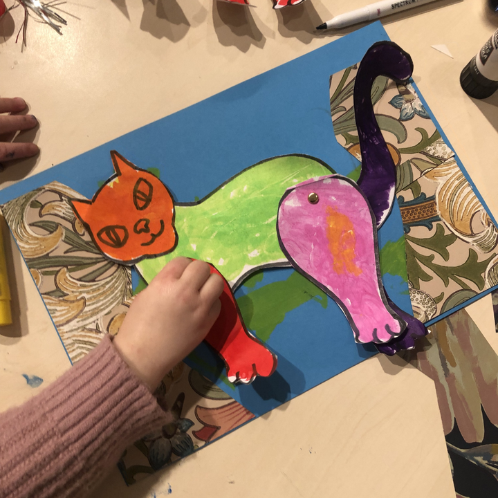 A piece of children's art featuring a cat.