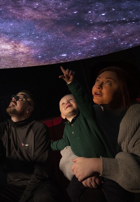 A family in a planetarium 