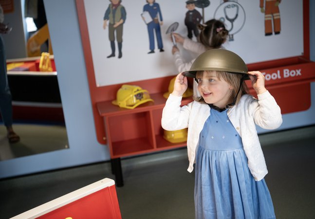 Small girl in old helmet 
