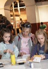 Parents and children enjoying craft activity