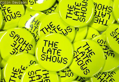 Lots of neon The Late Shows pin badges