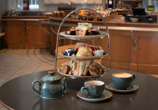 A photograph of a three tiered afternoon tea.