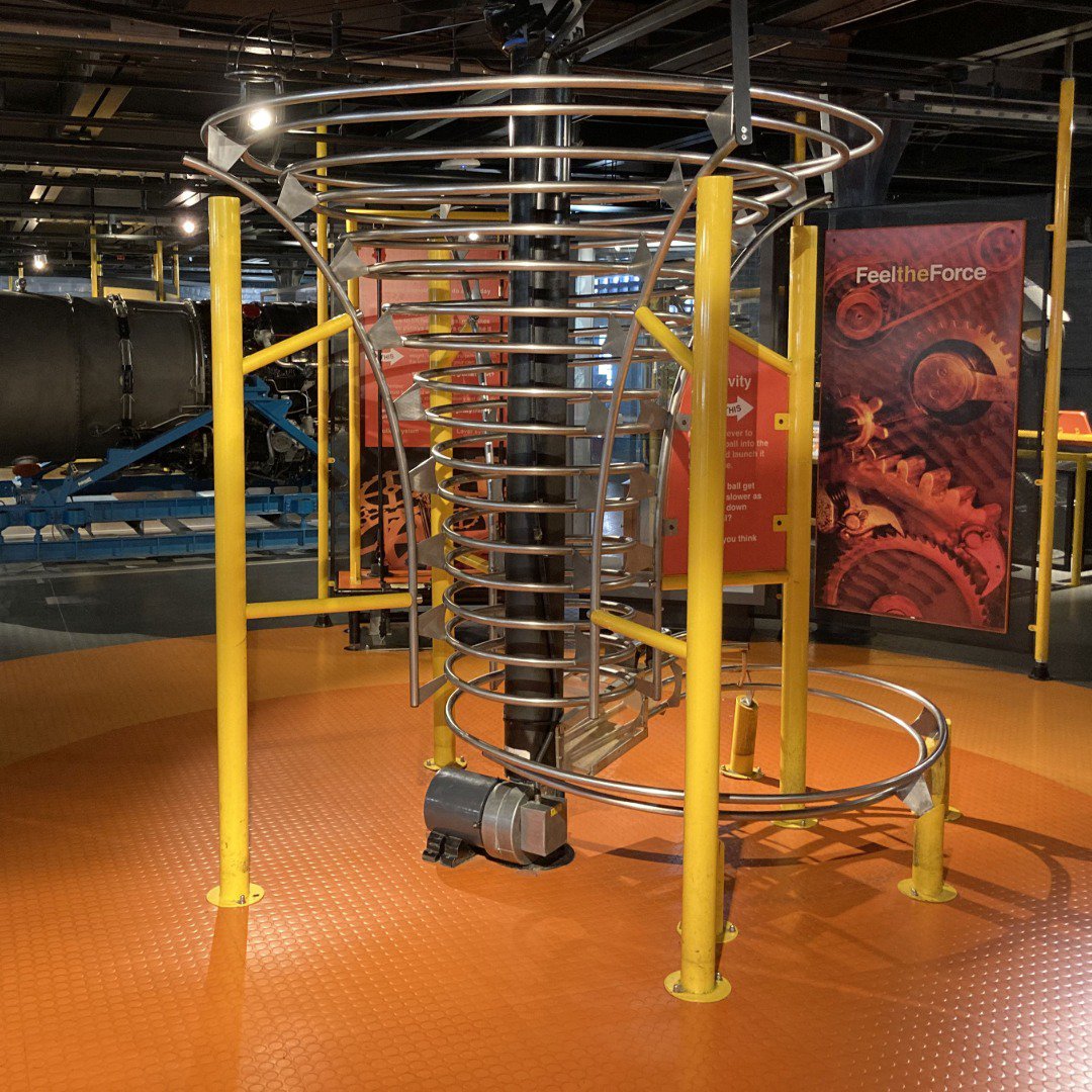Interactive exhibit at a museum, a large metal spiral Interactive exhibit at a museum, a large metal spiral