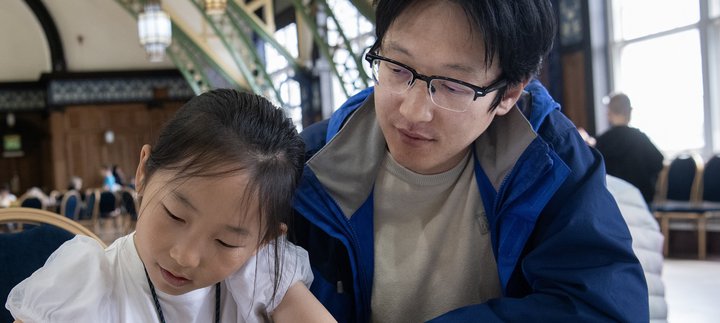 dad and daughter work together