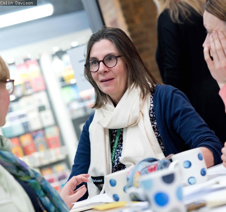 Three people sat at a table. 