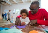 Baby and parent experiencing tactile play