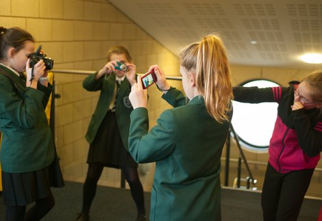 Schoolchildren use cameras