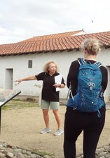 Woman giving a tour of an historic site