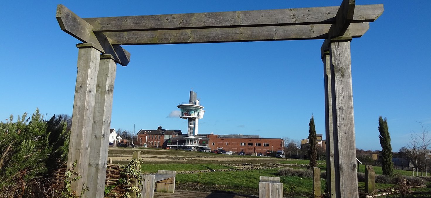 Viewing tower seen through wooden arch