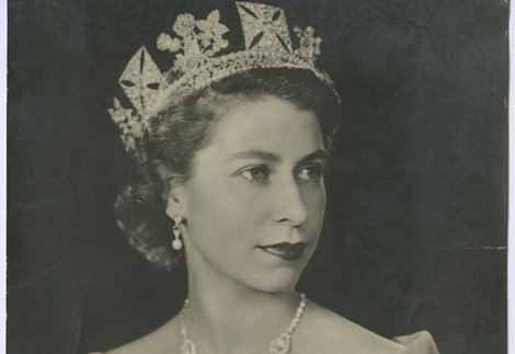 A black and white head and shoulders photograph by Dorothy Wilding, titled 'Her Majesty Queen Elizabeth II'. Series no. 711. 1950s