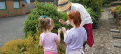 Children and adult in woodland walk area