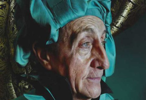 An oil painting of a man in profile. He is dressed in turquoise with a matching head wrap.]