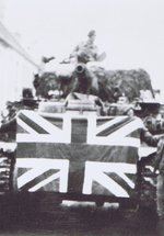‘Tank crew of the 13th/18th Hussars celebrating victory with the local population, 1945.’