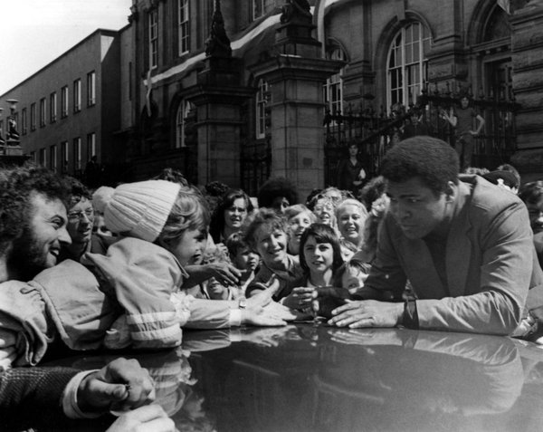 Muhammad Ali greets a young fan outside South Shields Town Hall on Saturday 16 July 1977. 