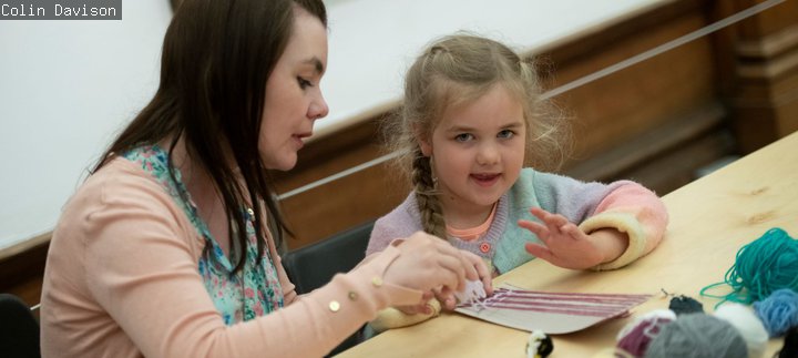 Women and child crafting with wool at Shipley