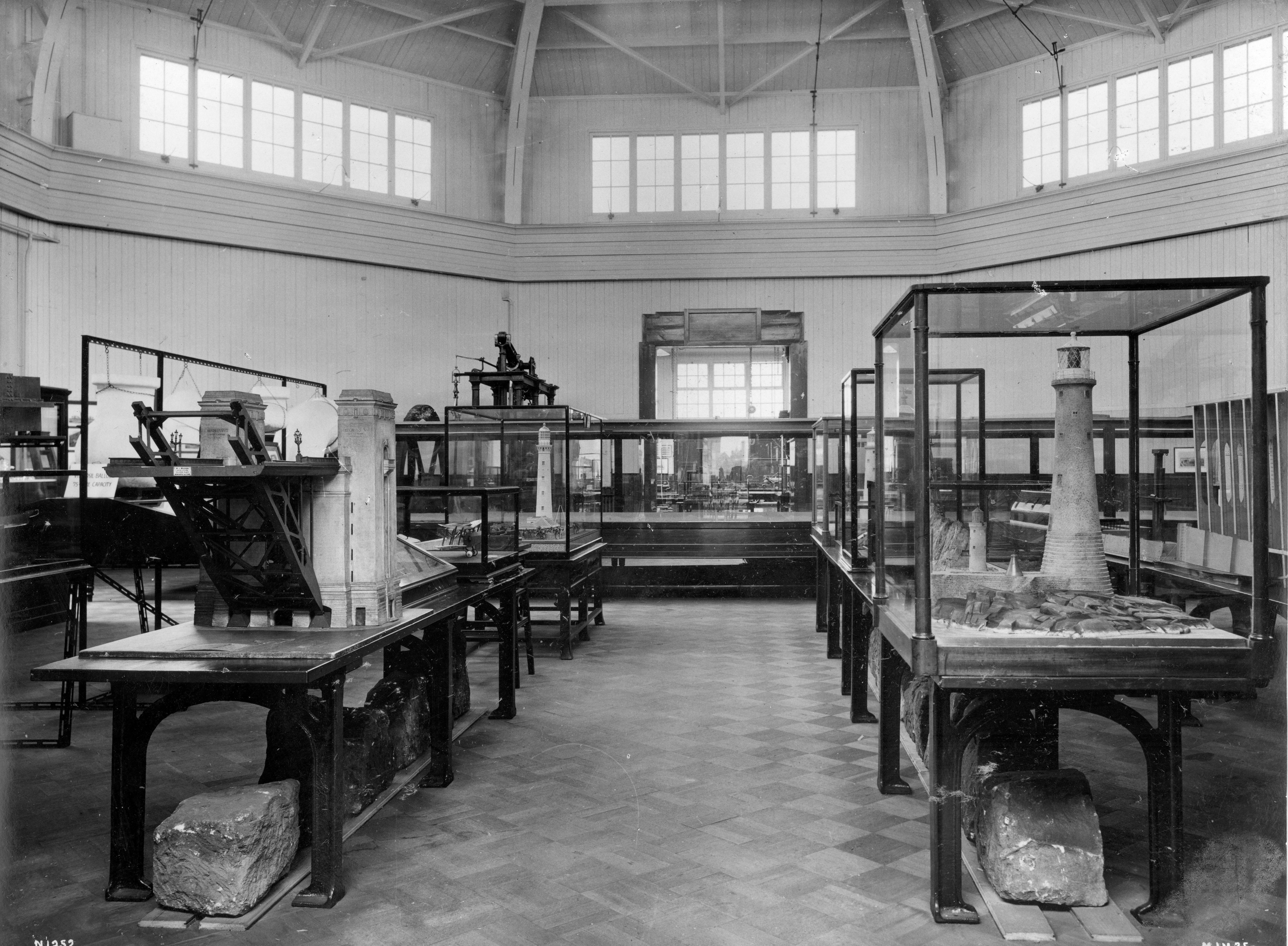 The Municipal Museum of Science and Industry interior with glass display cases on a wooden floor 