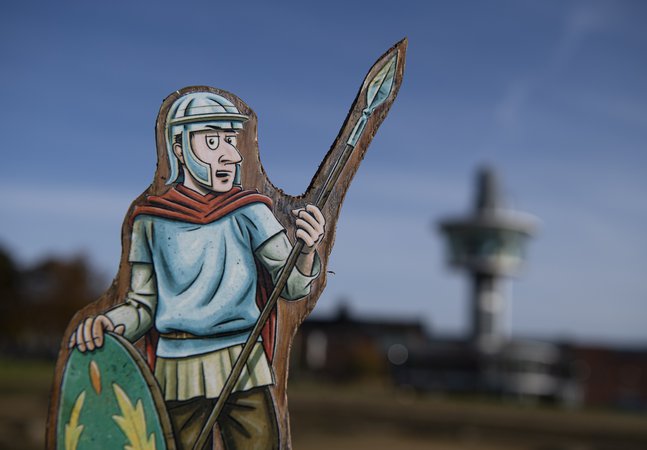 Cut out of Roman soldier with viewing tower in background