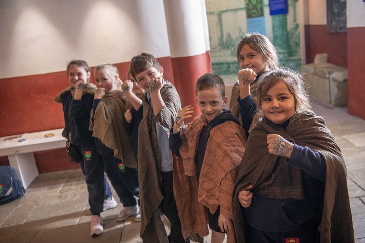Group of school children showing their painting hands
